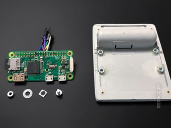 Raspi and screws next to back lid